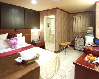 Golden Swallow Hotel - Thành phố Tân Trúc - Phòng ngủ