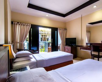 Champlung Mas Hotel Legian - Kuta - Bedroom
