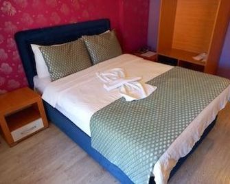 Safran Palas - Yenifoça - Slaapkamer