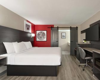 Ramada by Wyndham Cocoa - Cocoa - Schlafzimmer