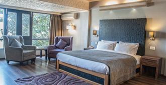 Ahdoos Hotel - Srinagar - Chambre