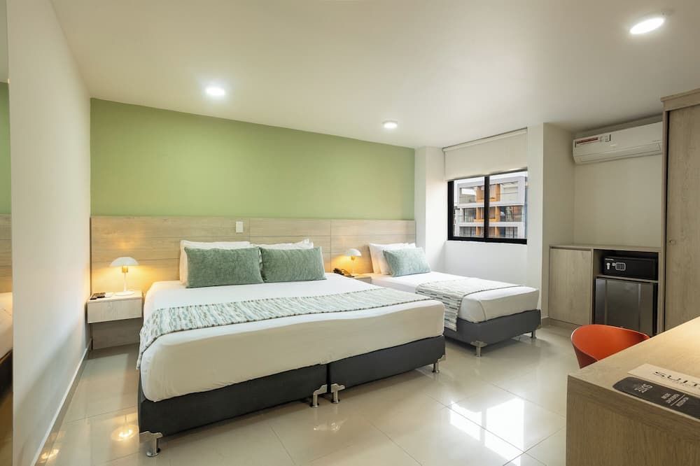 هوتل سويت كومفرت - ميديلين - غرفة نوم