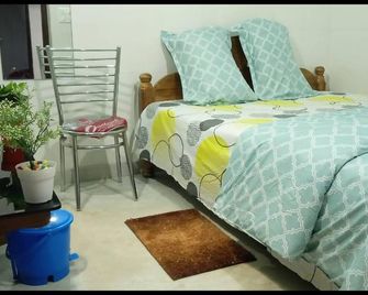 Okaasan Guest House & Restaurant - Konark - Bedroom