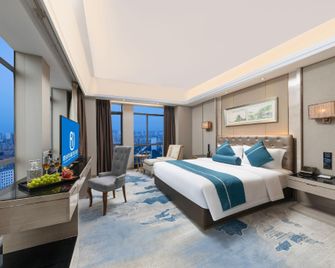 Junrui Huasheng International Hotel - Zhuzhou - Schlafzimmer