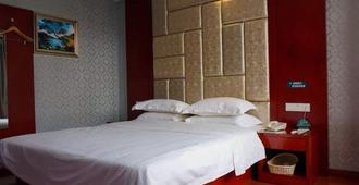 Greentree Inn Ganzhou Sankang Temple Darunfa Express Hotel - Ganzhou - Bedroom