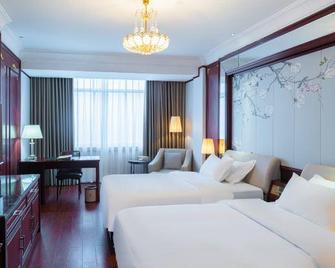 Won Gold Hotel - Qinzhou - Schlafzimmer