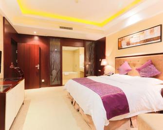 Oriental International Hotel (Leping City Donghu Park Branch) - Jingdezhen - Slaapkamer