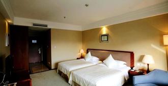 Yichang Guobin Garden Hotel - Yichang - Camera da letto