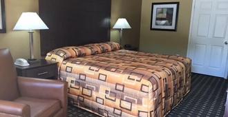 Executive Inn and Suites Longview - Longview - Bedroom