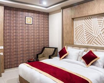 Emporio Hotel - Haldwani - Slaapkamer