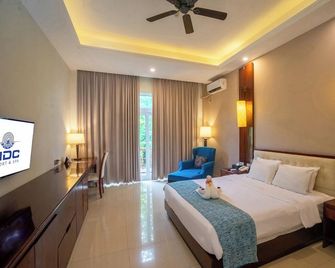 Manado Nusantara Diving Centre Resort & Spa - Manado - Yatak Odası