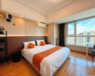 Mudanjiang Wanda Shiguang daily rental apartment - Mudanjiang - Camera da letto