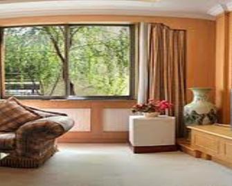 Qianhe International Hotel - لونغنان - غرفة معيشة