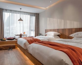 Yangshuo Lisa Boutique Hotel - Guilin - Schlafzimmer