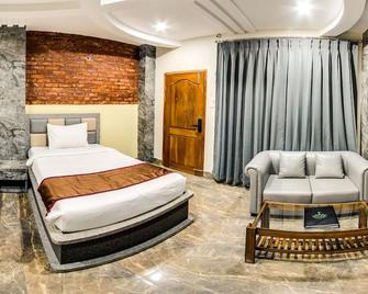 Aranya The Merian Resort - Gauhati - Schlafzimmer