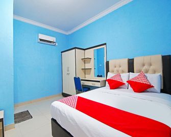 OYO 90752 Ridho Guest House Syariah - Dumai - Bedroom