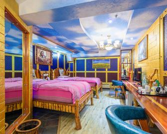 Qingdao Huake Holiday Hotel - Qingdao - Bedroom