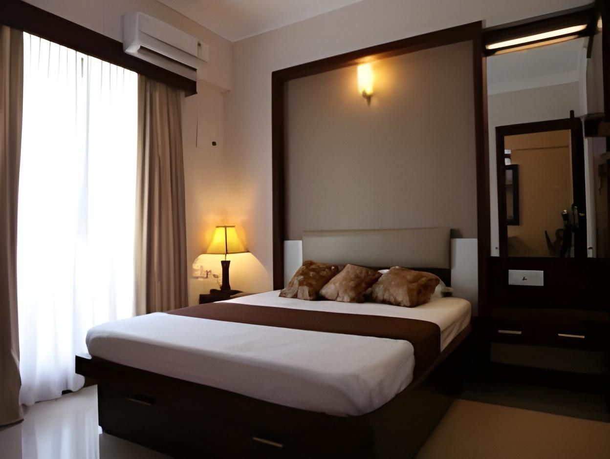 Krish Airport Hotels - קוצ'י - חדר שינה