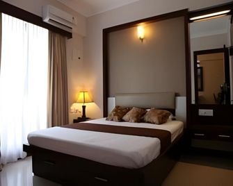 Krish Airport Hotels - קוצ'י - חדר שינה