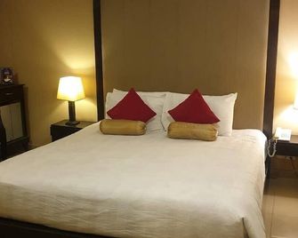 Hotel Grand Inn - Lahore - Slaapkamer