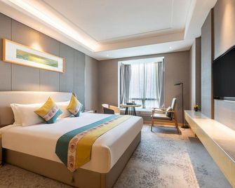 Shiyan Jiahua Holiday Hotel (Wuyan Shopping Mall People's Hospital Branch) - Shiyan - Camera da letto