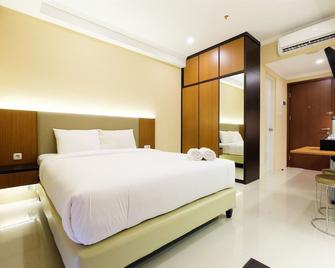 Well Designed Studio Apartment Signature Park Grande By Travelio - Yakarta - Habitación