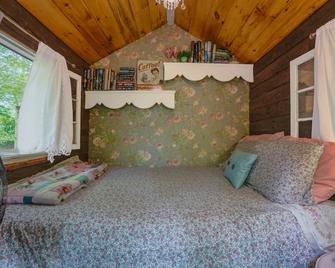 Little Wooded Retreat: Cozy Sleeping Cottage with Private Outhouse, TV/Wi-Fi - Pine City - Bedroom