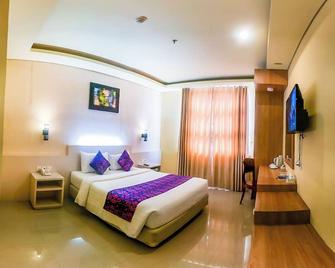 Grand Madani Hotel - מטראם - חדר שינה