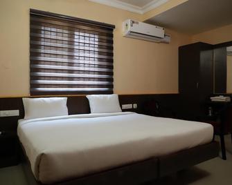 Namaskar Hotel - Kumbakonam - Camera da letto