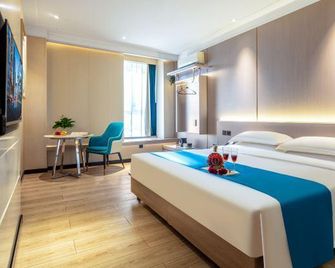 Tianjin Bindao Holiday Hotel - Tianjin - Schlafzimmer