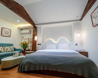 Wuhuashizhilv Hostel - ליז'יאנג - חדר שינה