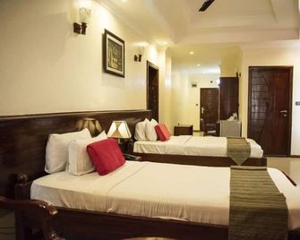 Hotel Sapphire - Daressalam - Schlafzimmer