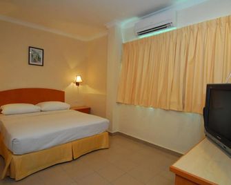 โรงแรมซิตี้สตาร์ - ซานดากัน - ห้องนอน