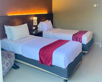 Sisingamangaraja Guest House - Semarang - Bedroom