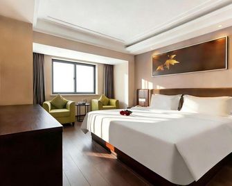 Greentree Sunshine Holiday Hotel (Nanchang Bayi Square First Affiliated Hospital) - Nanchang - Slaapkamer