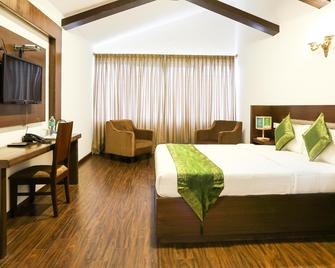 Treebo Skydale Inn & Suites With Mountain View - Ooty - Спальня