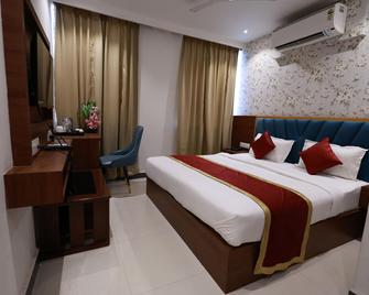 Hotel Tripka Square - Deoghar - Спальня