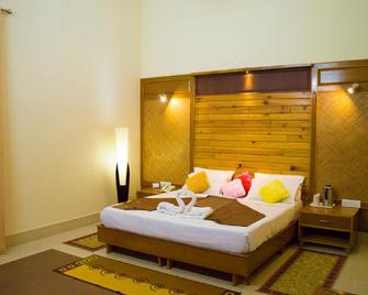 The Tiger Groove Corbett Resort - Nainital - Schlafzimmer