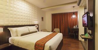 Citrus Hotel Kolhapur - Kolhāpur - Bedroom