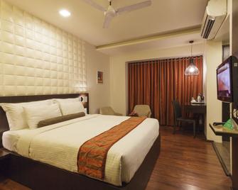 Citrus Hotel Kolhapur - Kolhāpur - Bedroom