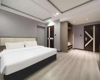 Tangfeng Art Hotel (Harbin Jiangpan) - Harbin - Bedroom