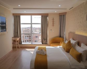 Sahariano hotel City Center - אל-עיון - חדר שינה