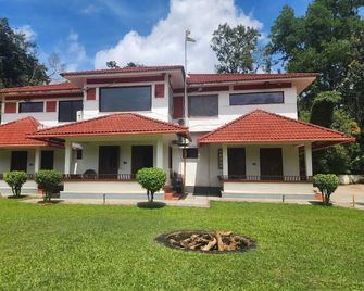 Tropical Blooms - Coorg - Kutta - Building