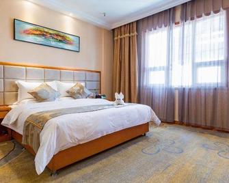Likelai Business Hotel - Qingdao - Qingdao - Schlafzimmer