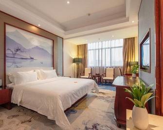 Nanning Qian Xi International Hotel - Nanning - Schlafzimmer