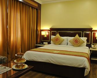 Dynasty Hotel - Guwahati - Bedroom