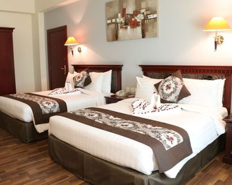 Pars International Hotel - מאנאמה - חדר שינה