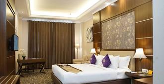 Adhiwangsa Hotel & Convention Hall - Surakarta City - Bedroom