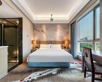 Yin Sheng International Hotel - Heze - Спальня