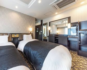 Apa Hotel Hiroshima Ekimae Shinkansenguchi - Hiroshima - Bedroom